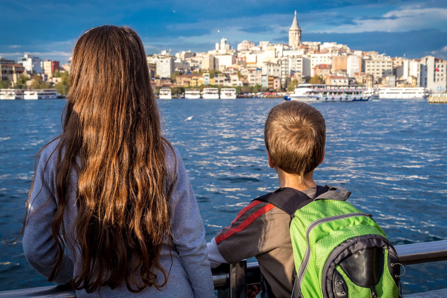 Tour Photos Kids Looking at Galata Tower from Bosphorus